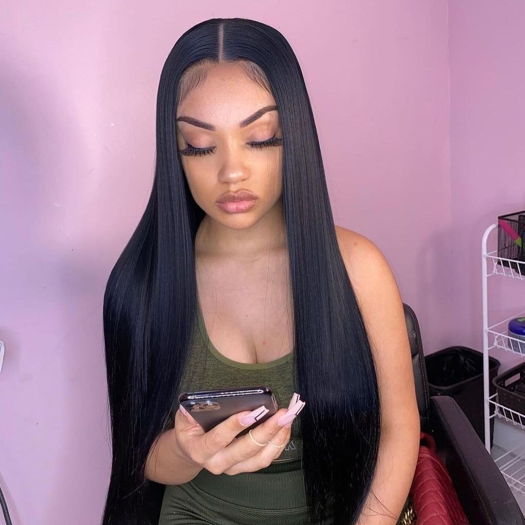 young lady wearing a long black virgin hair wig